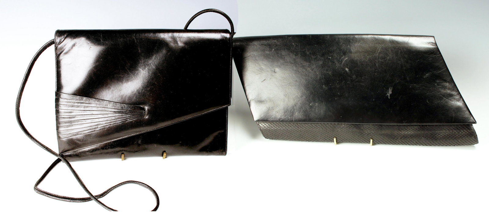 VINTAGE JOURDAN & MAGLI BLACK HANDBAGS PURSES: VINTAGE JOURDAN & MAGLI BLACK HANDBAGS PURSES Leather Bruno Magli with fan shaped embellishment on front and optional shoulder strap CHarles Jourdan rhomboid clutch in black leat