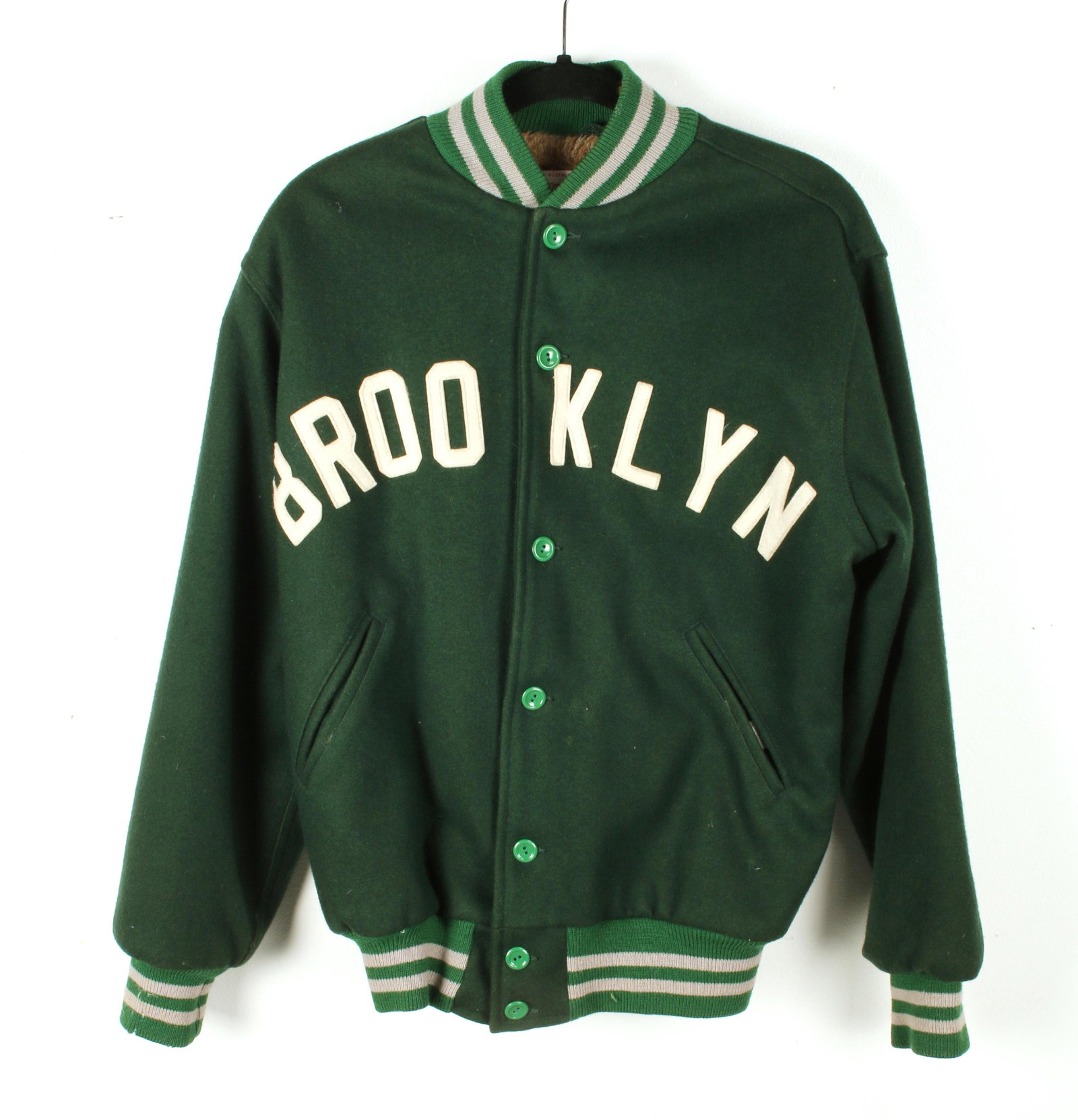 MITCHELL & NESS BROOKLYN VARSITY JACKET: MITCHELL & NESS BROOKLYN VARSITY JACKET Dark Green with white letters and stripes. Size M. Shipping: Shipping and handling in the