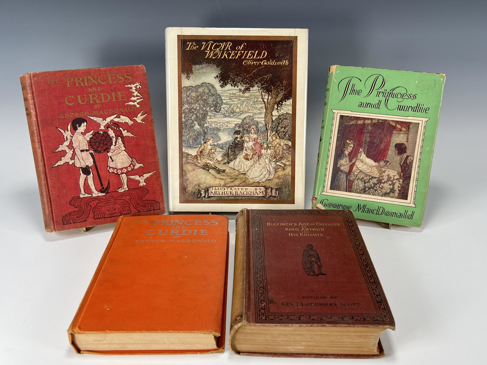 HARDCOVER CHILDRENS STORY BOOKS: HARDCOVER CHILDRENS STORY BOOKS Three The Princess and Curdie by George MacDonald. Bulfinch's Age of Chivalry or King Aurthur and His Knights by Rev. J. Loughran Scott. The Vicar of Wake