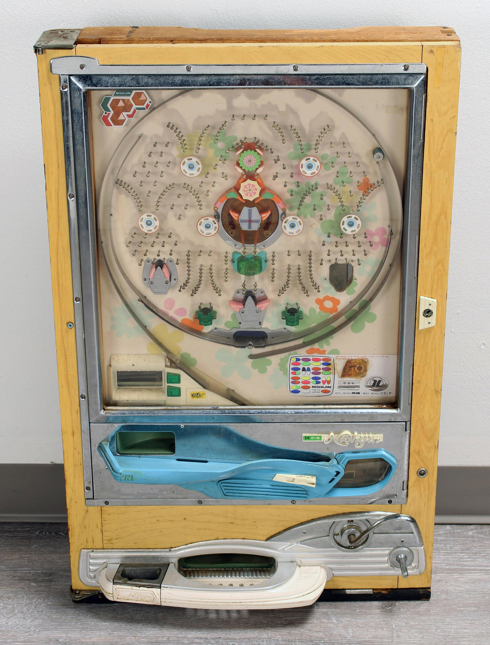 VINTAGE NISHIJIN PACHINKO MACHINE: VINTAGE NISHIJIN PACHINKO MACHINE Manufactured in Japan in the late 1960's to early 70's. Includes original balls. Untested. 20 1/2" X 5 1/2" X
