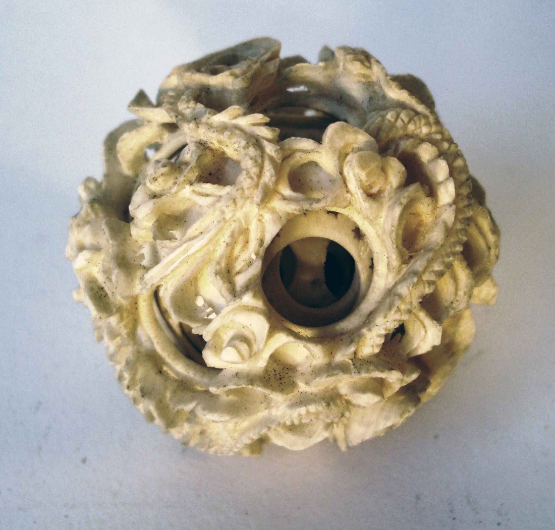 Carved Dragon Ball: A 2 3/4" spherical ball with round piercing between intertwined dragons that reveal 6 or 7 more balls within.