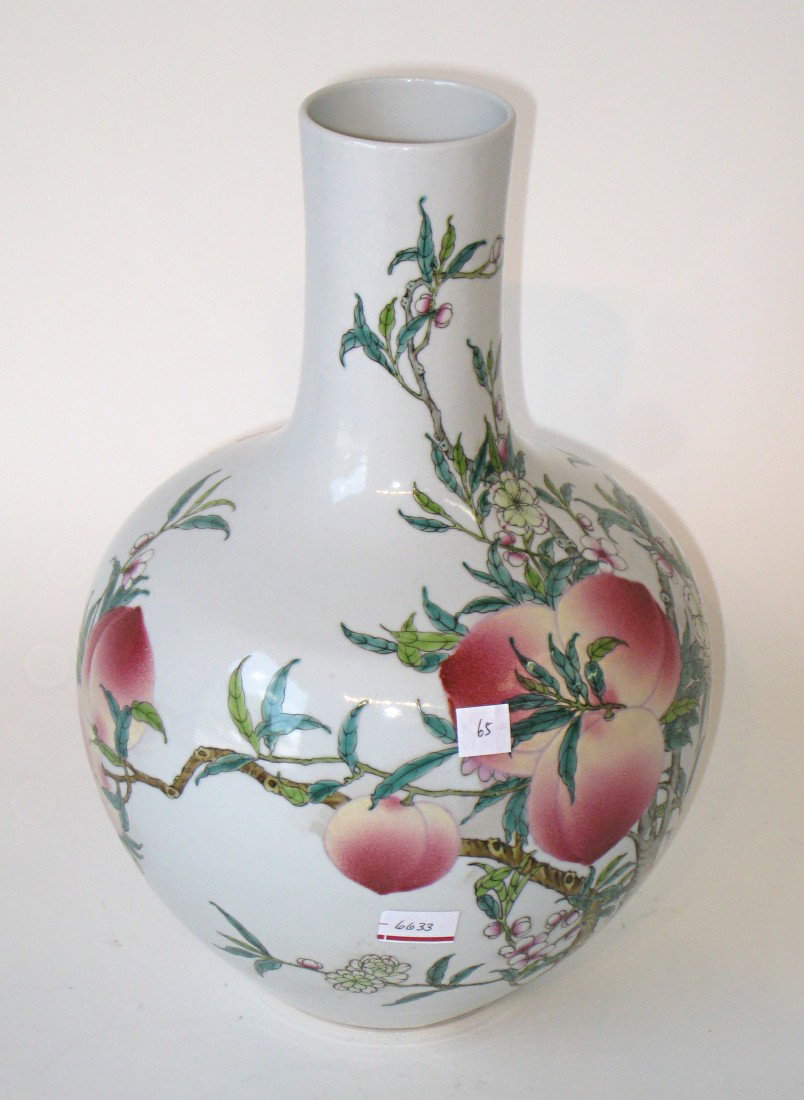 Qing Dynasty Style Vase: A 13" vase with bold glaze decoration with budding peaches and flowers and bats of good fortune. Six character signature at the bottom.