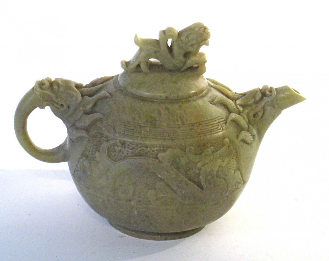 Soapstone Tea Pot: A greenish color soapstone carved tea pot, about 4" in height.