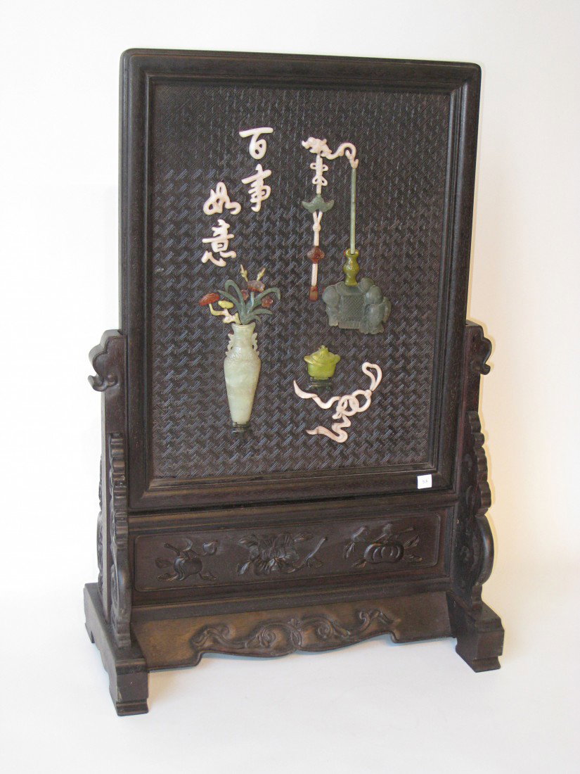 Chinese Rosewood Screen: A 19th century 28" rosewood screen with the panel decorated with several colors of jades or hardstones against a carved wood background. 18 1/2" long.