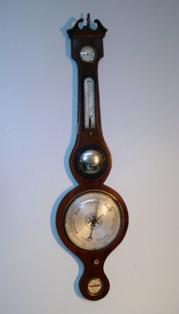 Banjo Barometer: A mahogany inlaid banjo type barometer with silvered round dial with a Mercury charged tube mounted behind.