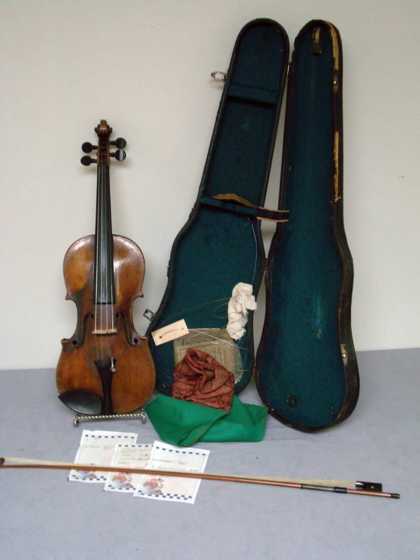 Violin: A 19th century violin, complete with fitted case, bow, and extra strings. Inside are pasted labels: "Wilhelm Fredel, Dresden, 1875" and another dated 1892. The instrument in fair to good condition, sh
