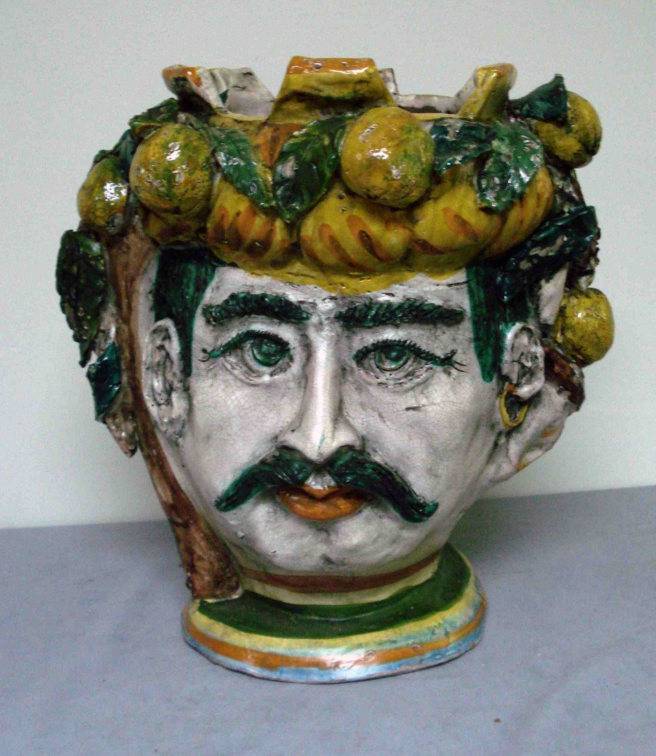 Ceramic majolica jardineier: A faience glazed mask in multi-colored glazes of a bearded man. 16" tall about 14" across.