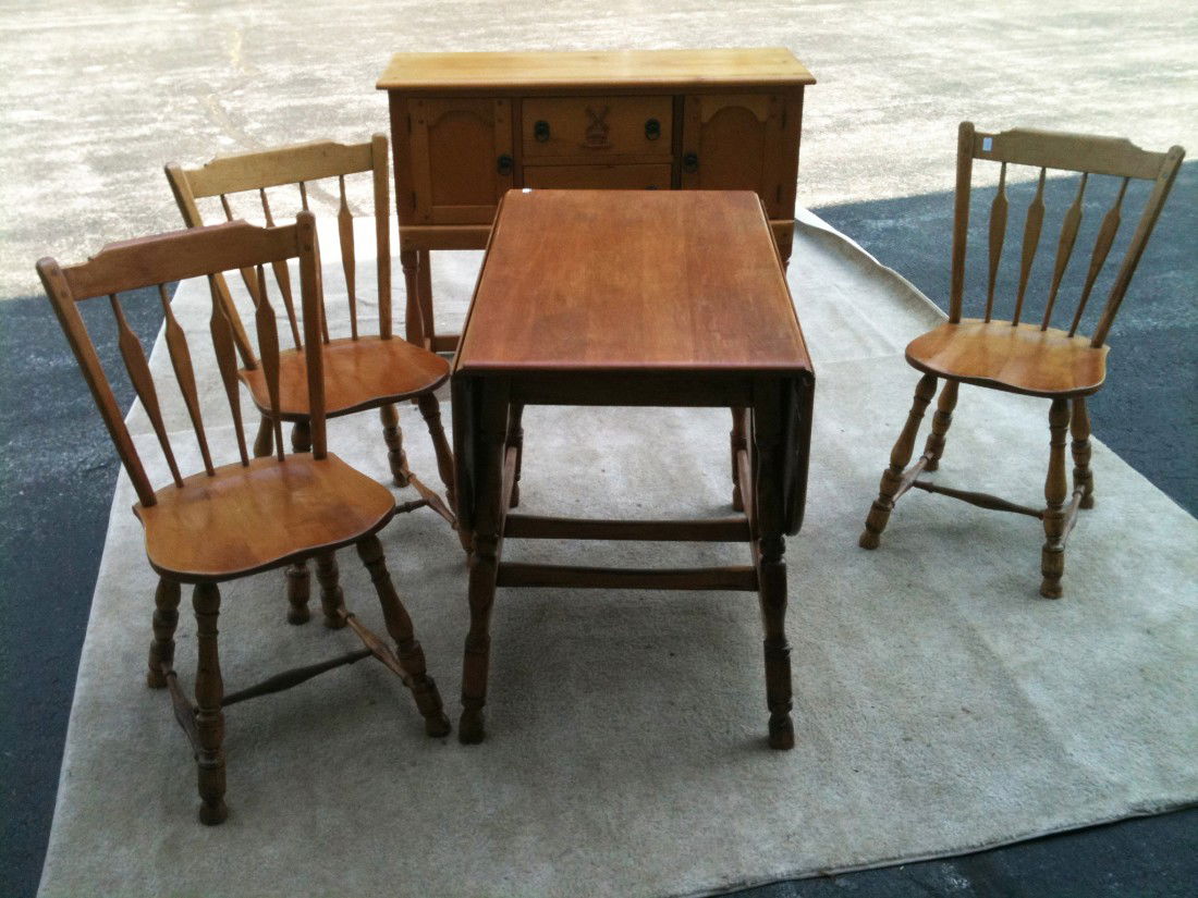 Kitchen Set- Sideboard, Chairs And Table: Three side chairs, drop leaf table, 30" X 36" X 50" and server with matching spinning wheel. The spinning wheel with a supply of wool.
