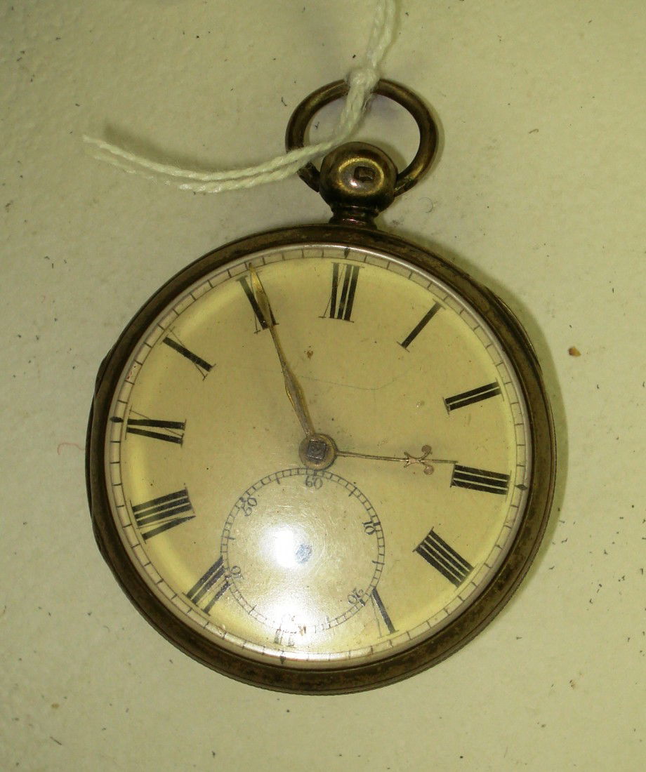 Silver Pocket Watch: A sterling silver opened faced swing out cased English pocket watch of the mid 19th century. Has a fusee movement with pierced watch cock, missing seconds hand.