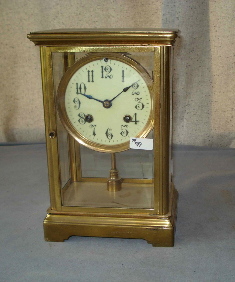 Mantel Clock By The Vermont Clock Co,: A 901/2" brass and bevel glass cased mantel clock by the Vermont Clock Co. of Fairhaven, VT, ca 1891 - 1910. This has a balance wheel escapement(no pendulum), and a strike mechanism. The back door gla