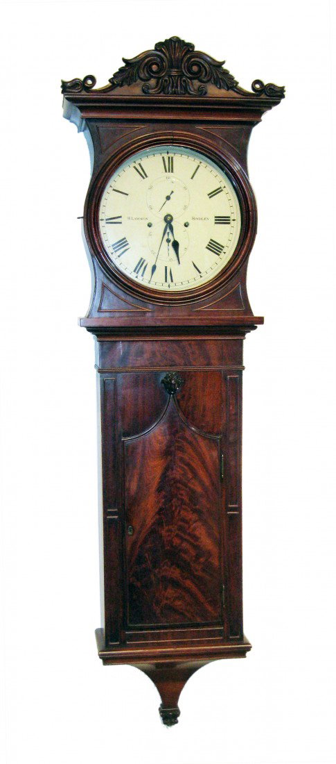 Early 19th Century Wall Clock: A fine mahogany cased 19th century English mahogany wall clock signed "H. Lawson Hindley", with a superbly made case attributed to the English cabinetmaker Edward Palmer with an eight day weight power