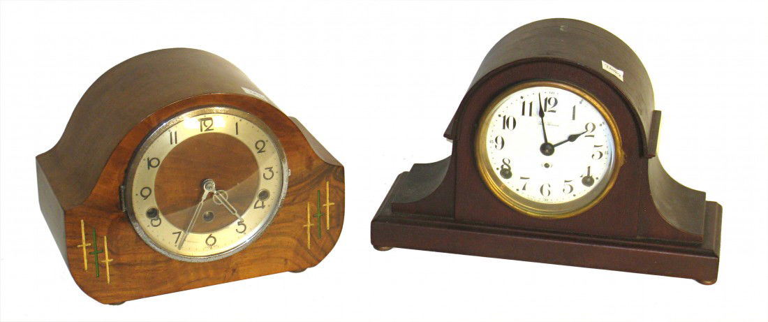 Two Mantel Clocks: Two mantel clocks include a Walnut cased and mahogany cased mantel clocks of mid 20th century origin. Each about 8-10" in height.