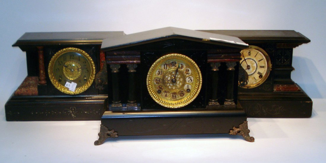 Three American Mantel Clocks: One with red columns is in pretty good condition, although lacking the suspension and pendulum bob; Another by Welch lacks the bezel and pendulum bob; The Gilbert, which has the less usual "bim-bam" s