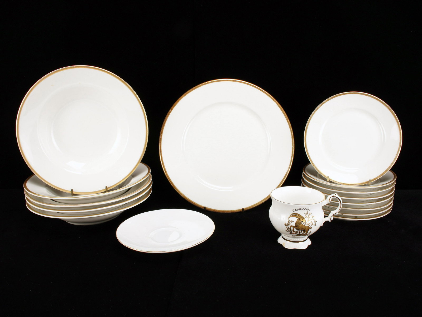 BAVARIA SCHUMANN ARZBERG GERMANY WHITE AND GOLD DISHES: BAVARIA SCHUMANN ARZBERG GERMANY WHITE AND GOLD DISHES 1-9 1/2" dinner plate, 5 soup bowls, and 8 bread plates all with gold trim and marked Lamberton on bottom. Capricorn cup marke