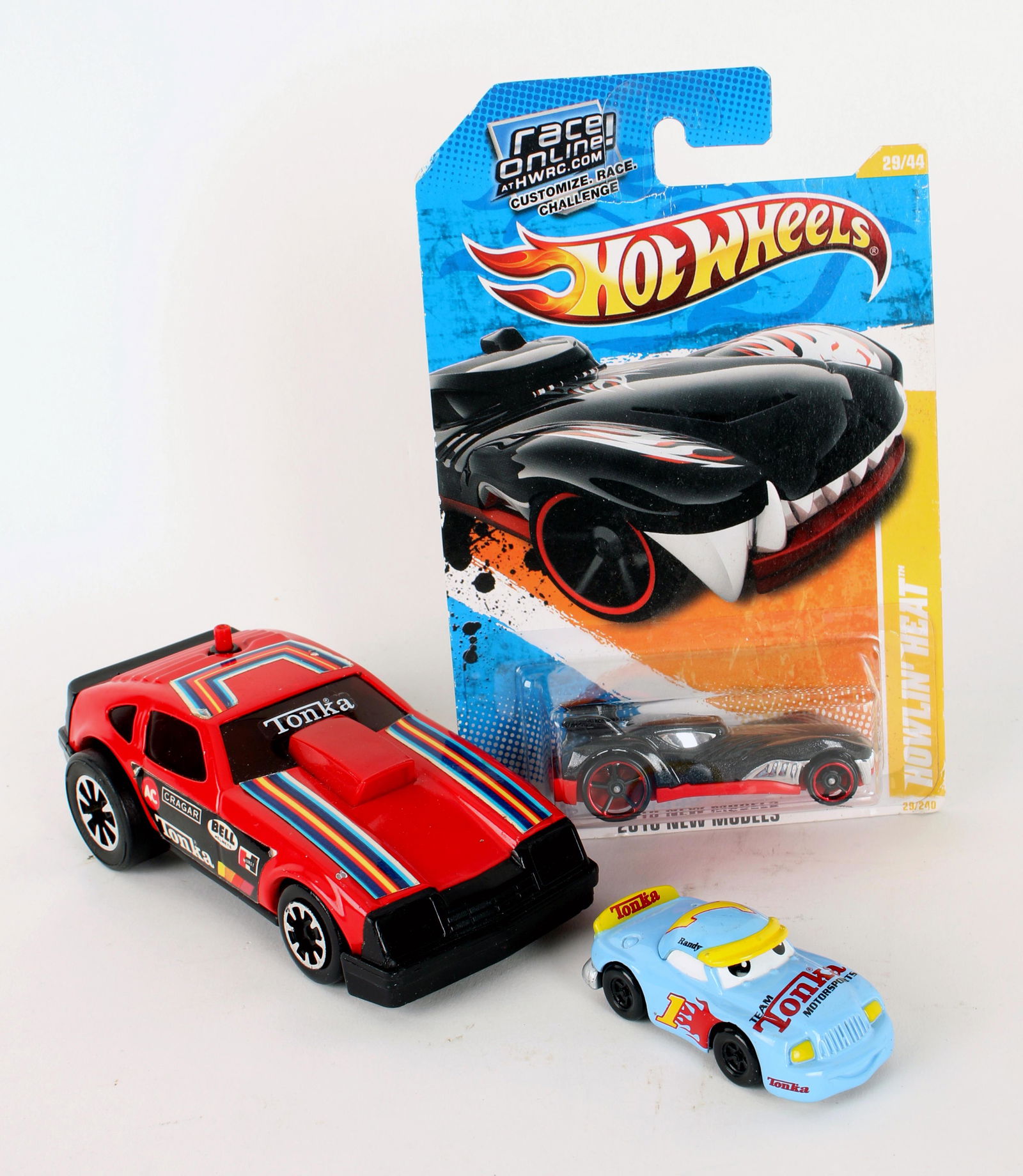 3 TOY CARS TONKA HOT WHEELS: 3 TOY CARS TONKA HOT WHEELS Hot Wheels NIB Howlin' Heat. Tonka 146 car. Tonka Team Motorsports Randy 2002 Hasbro. 5" Shipping: