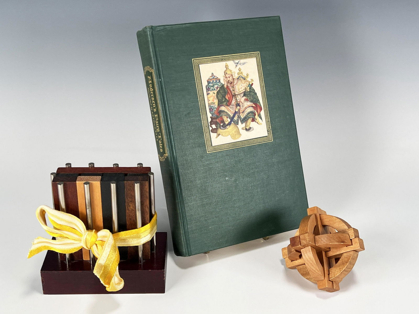 ANDERSONS FAIRY TALES & WOODEN PUZZLE GAMES: ANDERSONS FAIRY TALES & WOODEN PUZZLE GAMES Anderson's Fairy Tales Illustrated by Arthur Szyk. Two wooden brain teaser puzzle games. 5 3/4" X 8 1/