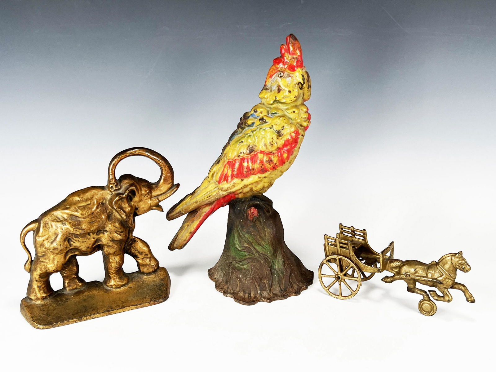 THREE CAST IRON DOOR STOPS BOOKENDS (1 of 11)