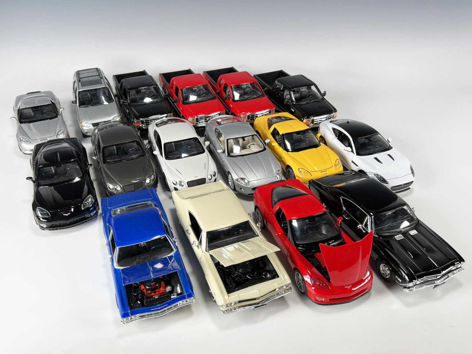 LOT OF WELLY SCALE MODEL CARS: LOT OF WELLY SCALE MODEL CARS Wide range of cars in this lot. Impalas, Corvettes, Jaguar, Ford, and more. 8 1/4" x 3" x 2 3/4"