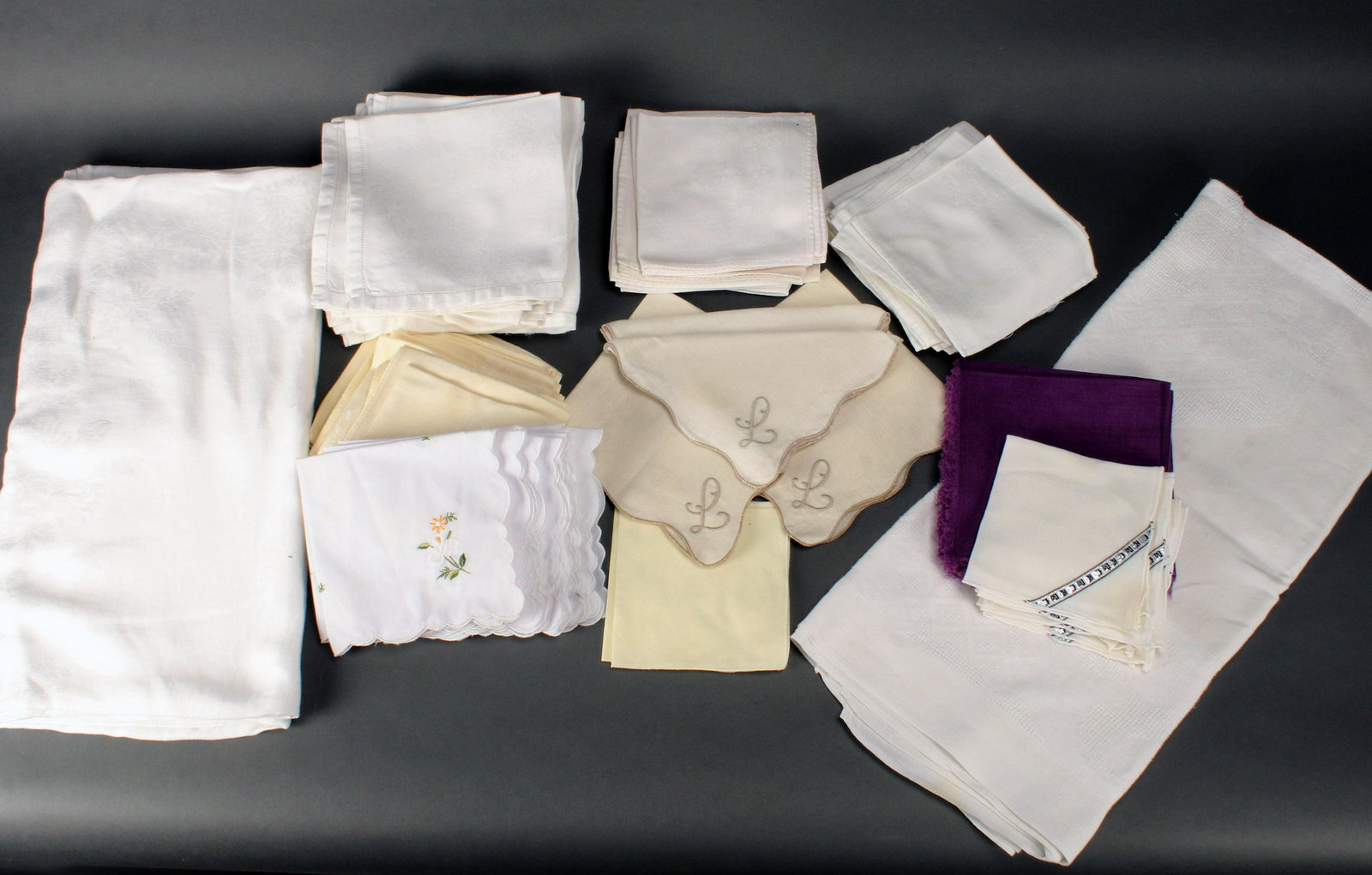 VINTAGE LINENS LOT NAPKINS TABLECLOTHS: VINTAGE LINENS LOT NAPKINS TABLECLOTHS Stacks of napkins and two tablecloths. Tablecloths: 70" X 86" - 64" X 48" S