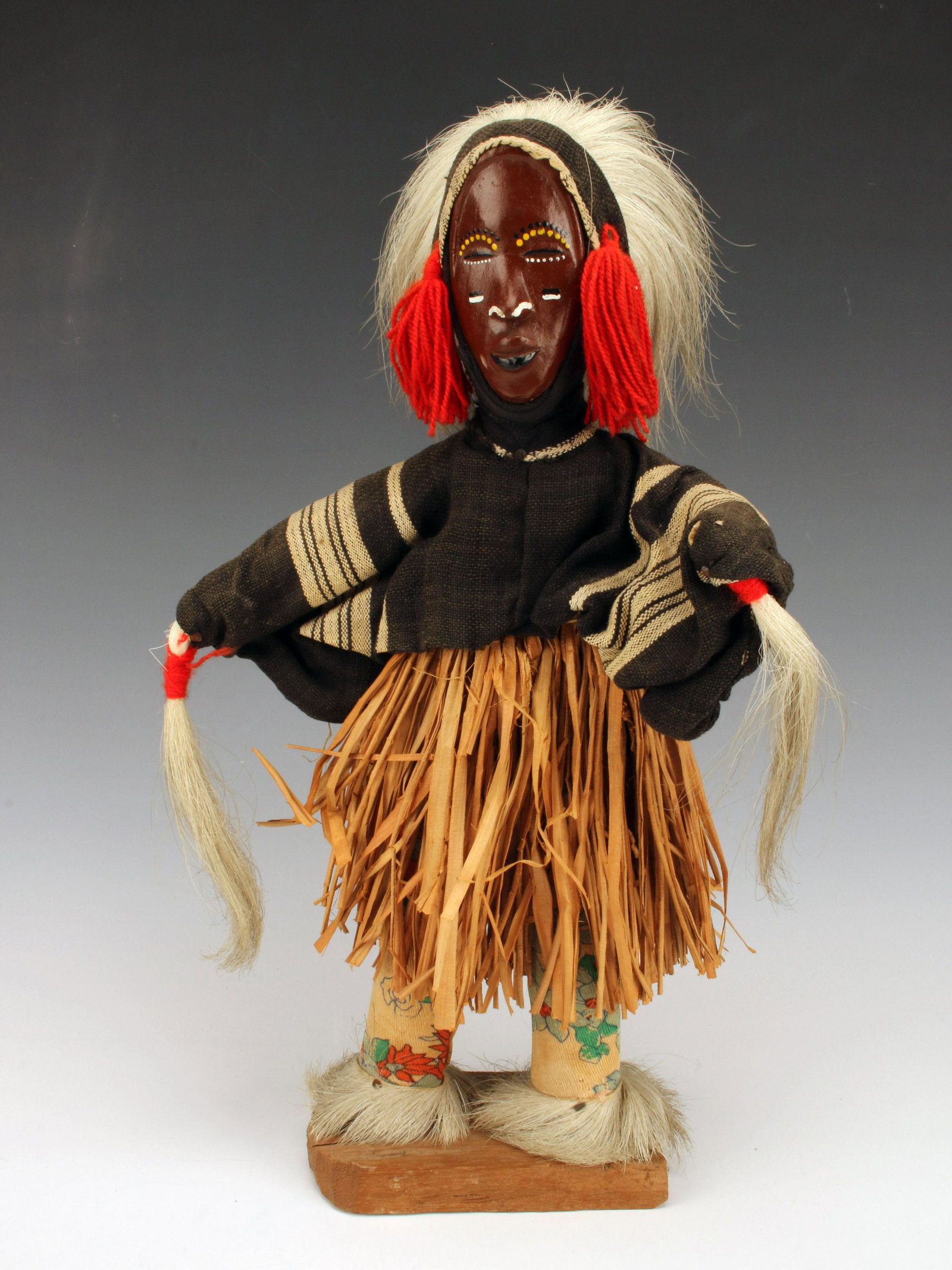 A BEAUTIFUL DANG FIGURE THE DANCER LIBERIA WEST AFRICA: A BEAUTIFUL DANG FIGURE THE DANCER LIBERIA WEST AFRICA Dancer in ceremonial dress including headdress, straw skirt, hair/fur embellishments, and woven fabrics.