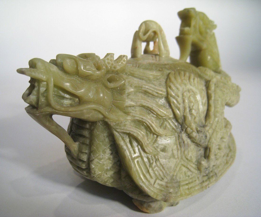 Lidded Dragon Theme Tea Pot: A 6" long well carved soapstone lidded dragon tea pot.