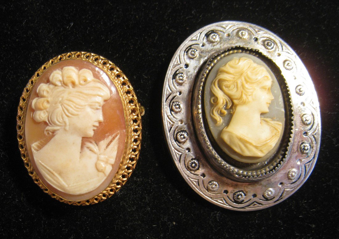 2 Oval Form Cameos: A carved oval form Carnelian Shell Cameo possibly of Naples origin, with a pierced gold surround, to be worn as a pendant or pin. Twentieth century. This together with a carved cameo of a ladies profi