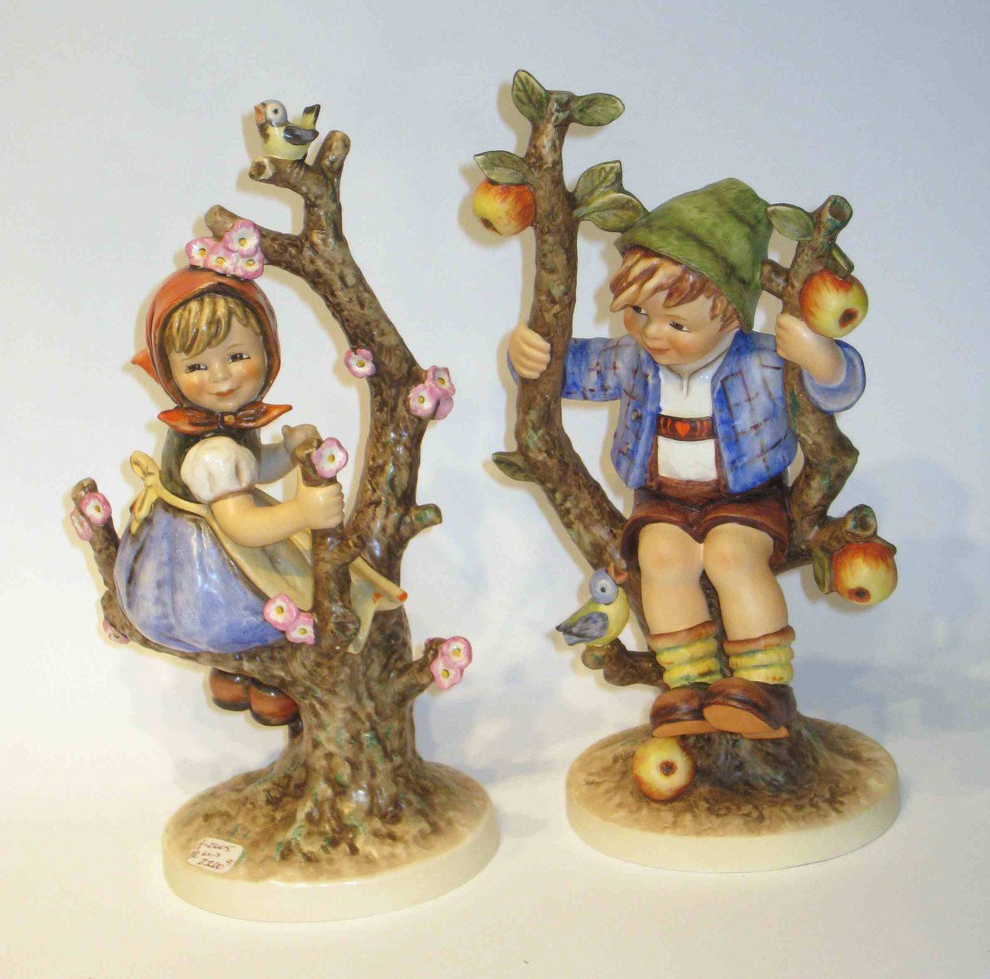 Hummels: The "Apple Tree" Girl And Boy: Two 9" Hummels both with the Goebel mark. The blue birds tail feathers are broken off.