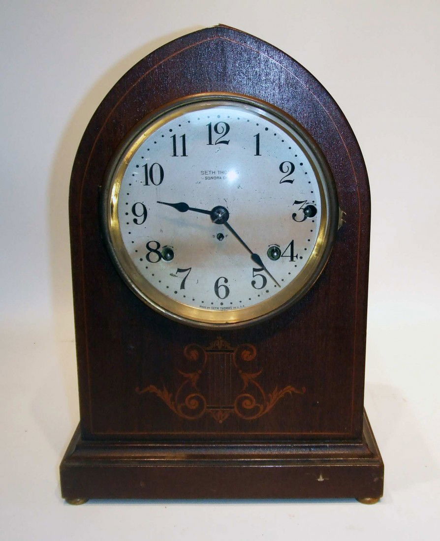 Sonora Chime Clock: An eight day Sonora Chime clock by Seth Thomas with five bells chiming every quarter hour. Found in an attic, this early 20th century mantel clock is in pretty good condition: it may need a renewing o