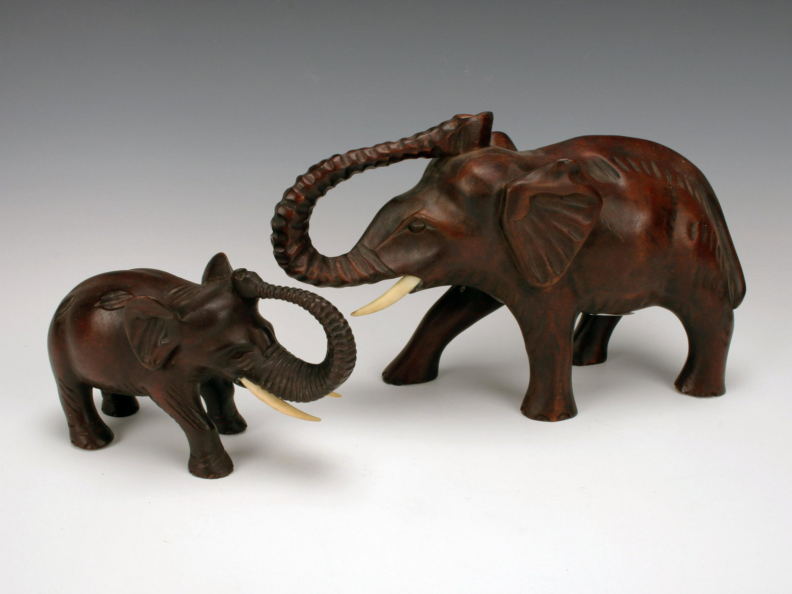 CARVED DARK WOODEN ELEPHANTS (1 of 7)