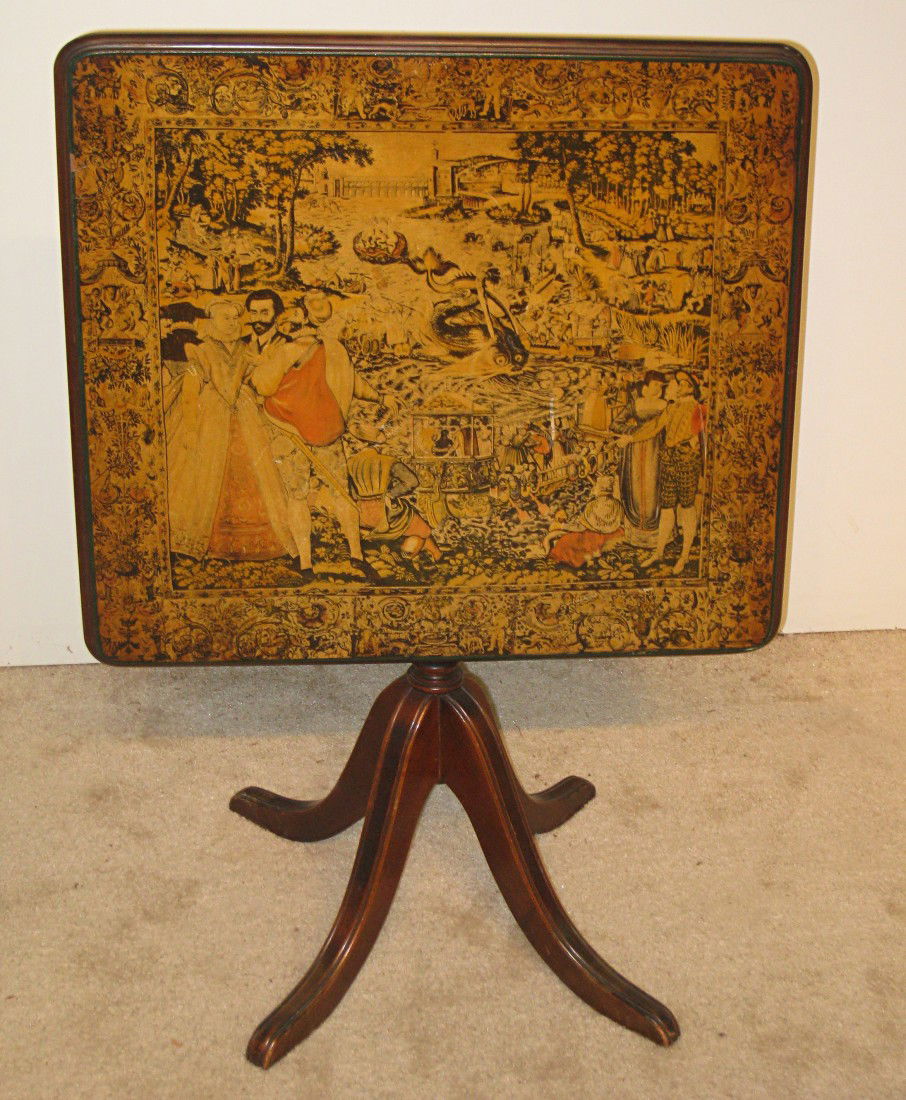 Duncan Phyfe Style Table: A tilt top lithograph decorated square tea table with saber legs. 26" square.