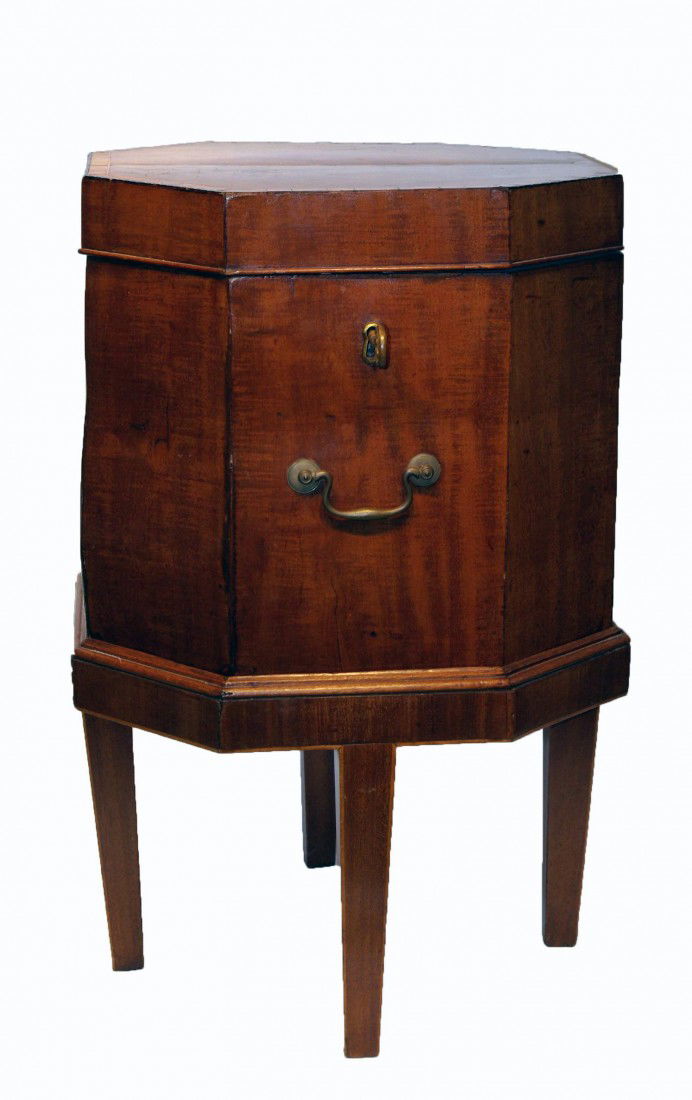 Cellarette: An octagonal shaped cellarette with a mahogany stand and taper legs. Features cross banding and line inlay.