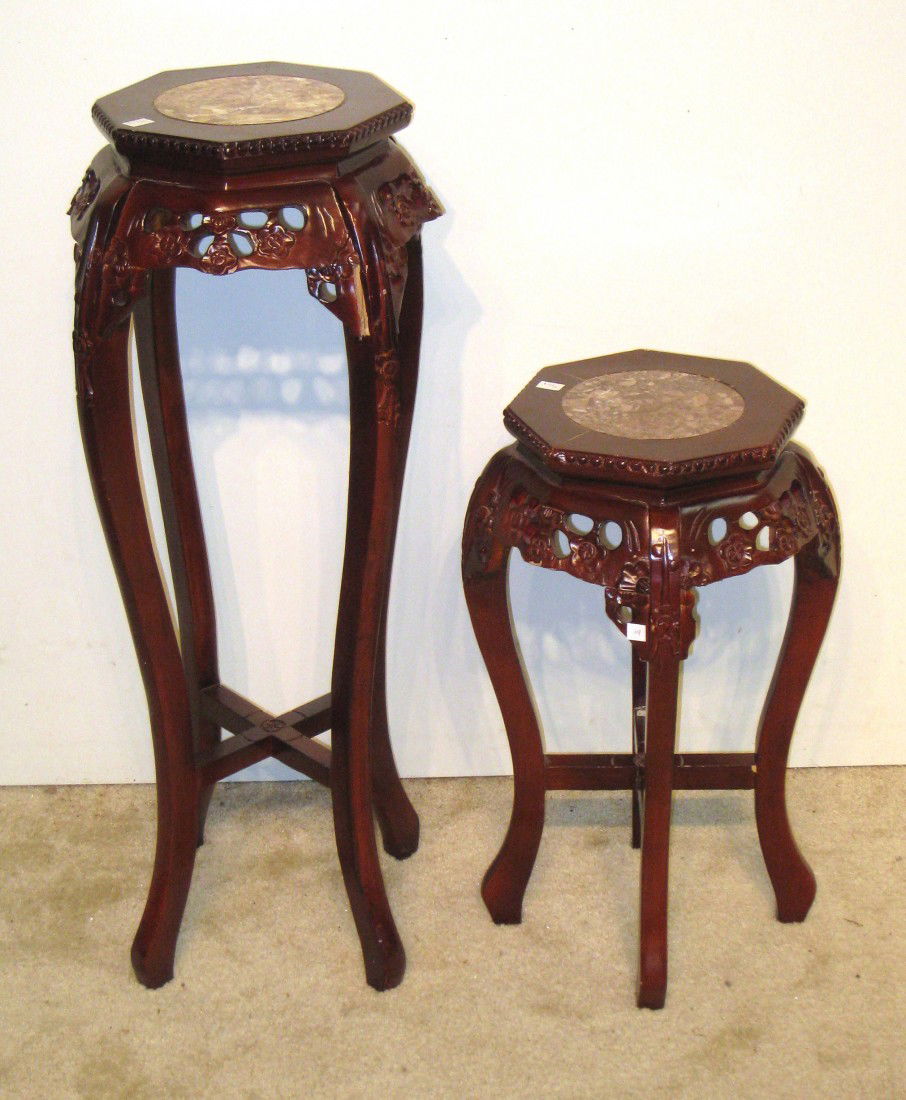 Two Rosewood Stands: Two rosewood stands with round solid marble inserts on the tops, one 24" the other 36" with 12" tops.
