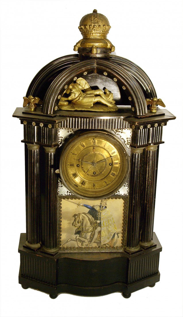 Austrian Clock With Black Case: An unusual early 19th century Austrian mantel clock with almost all wood construction in ebonized wood. The clockworks strike the quarter hours on a two day running clockworks. A calendar is also feat