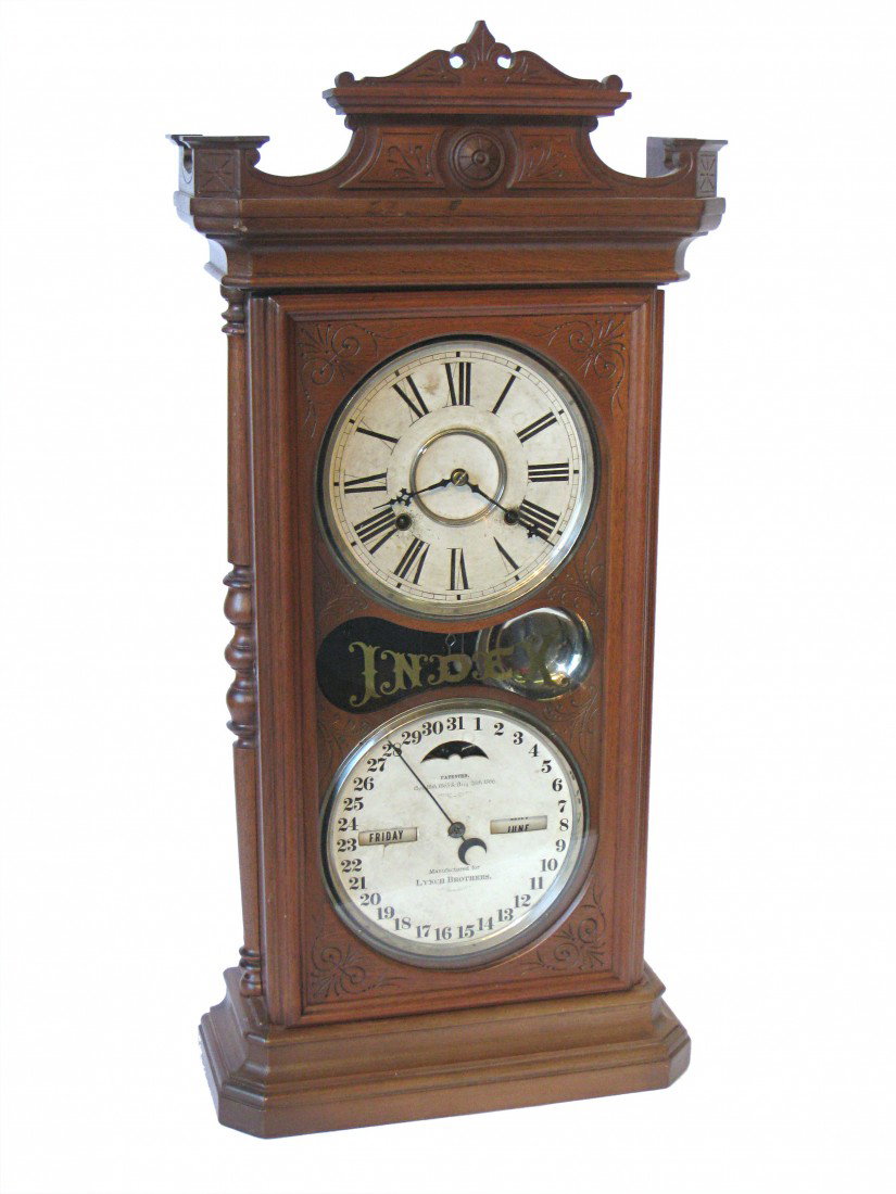 Ithaca Calendar Clock, The "Index": With a 31 1/2" high walnut case and double dial format.