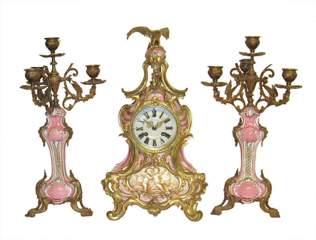 Porcelain Royal Bonn by Lenzkirch: A highly decorative garniture clock set by the German/ Austrian 19th century firm of Lenzkirch. Stunning colors achieved in the porcelain with fine castings. The clock is 16 1/2" and 9 1/2" wide.