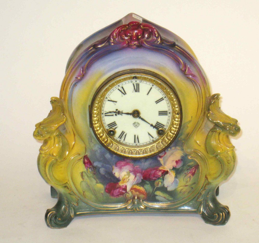 Ansonia Royal Bonn Clock La Charoy: An American late 19th century Royal Bonn cased clock in the art nouveau style, 11 1/2" X 10 1/2".