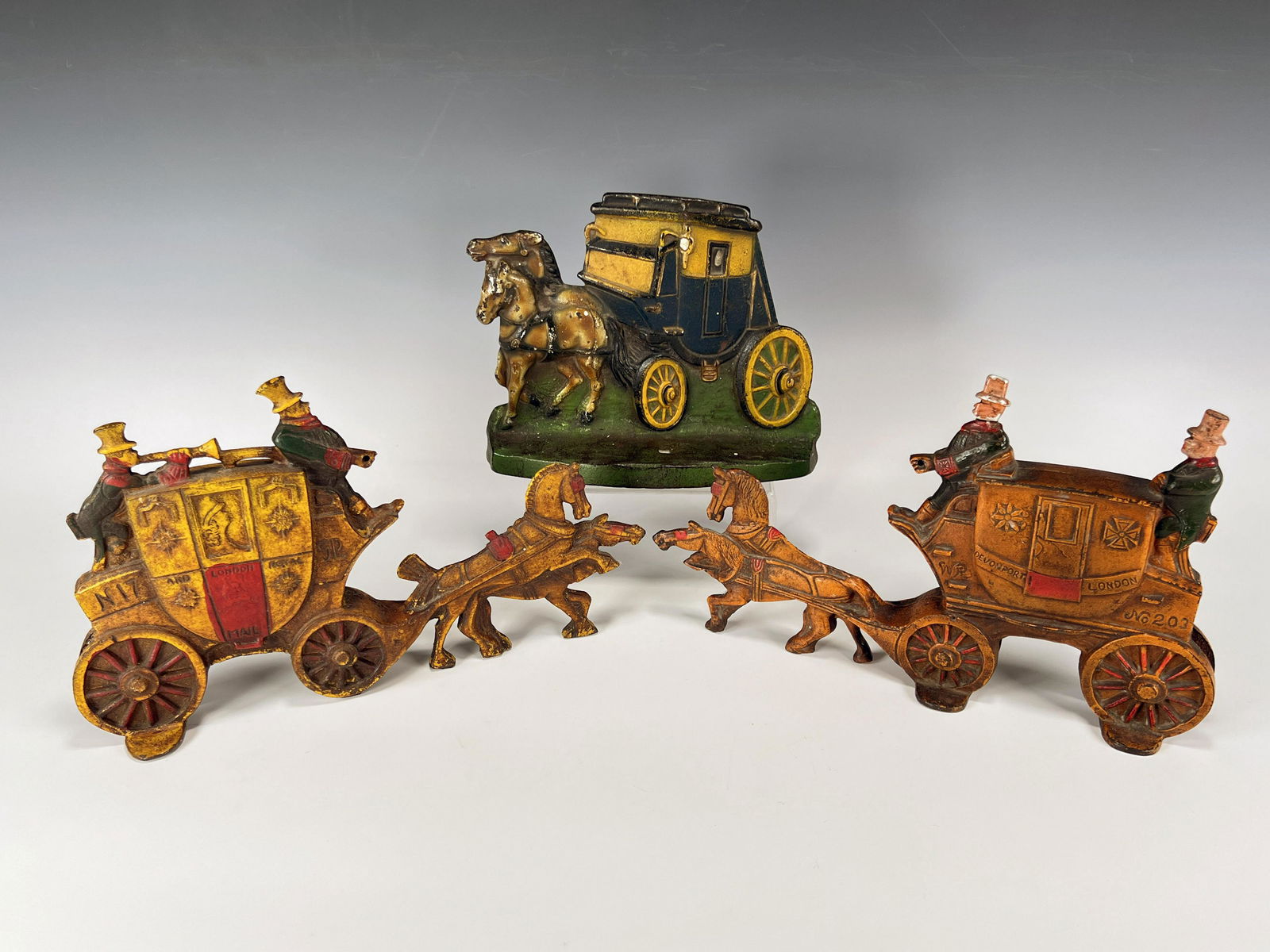 THREE CAST IRON HORSE COACH DOORSTOPS (1 of 9)