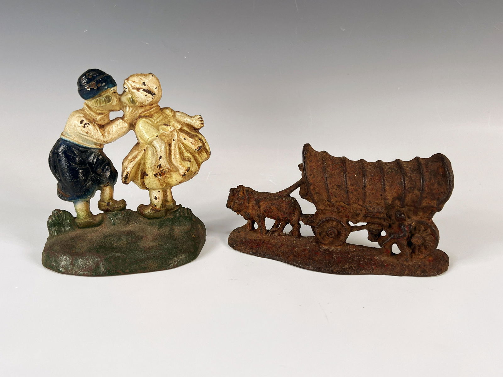 TWO CAST IRON DOOR STOPS (1 of 11)