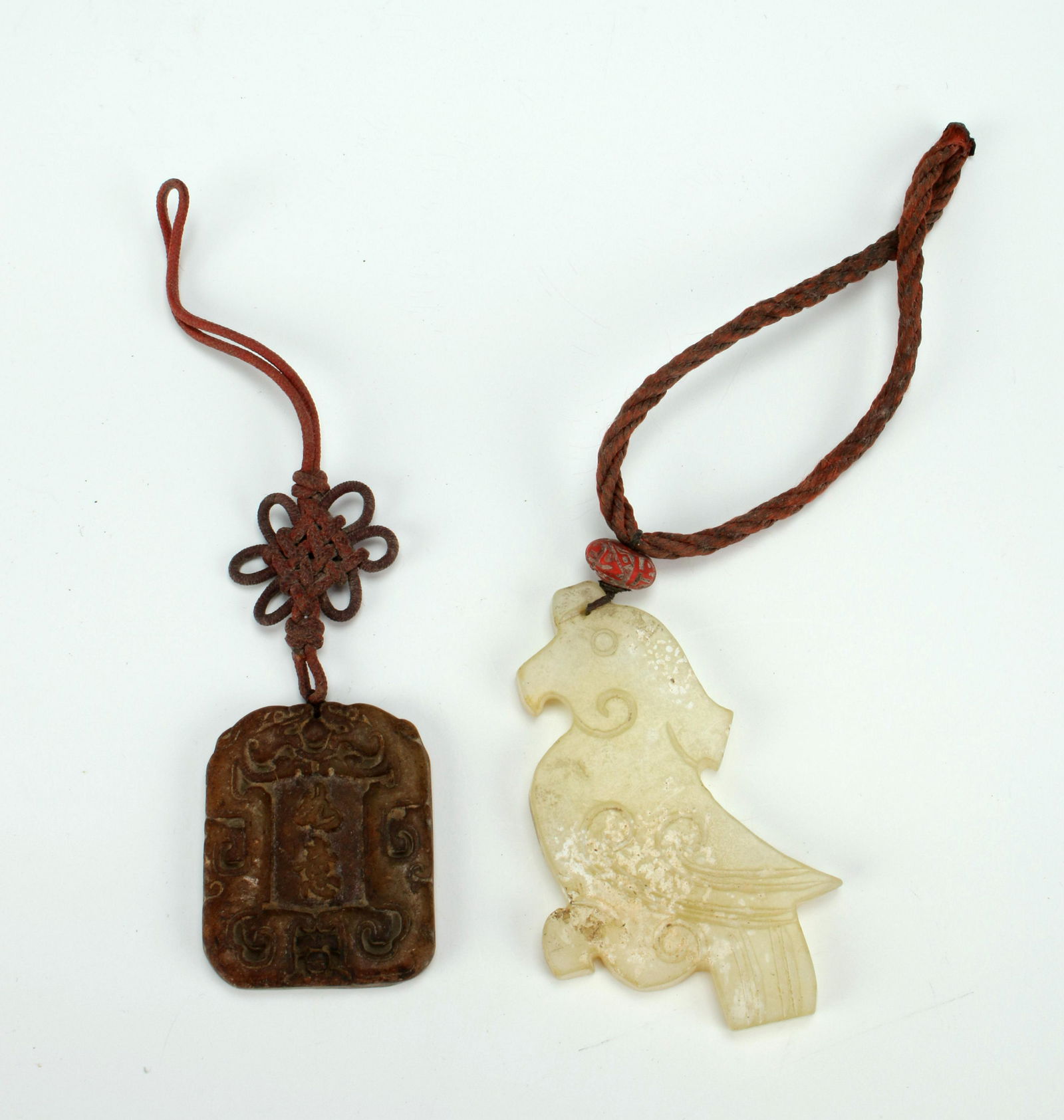TWO CARVED JADE PENDANTS (1 of 4)