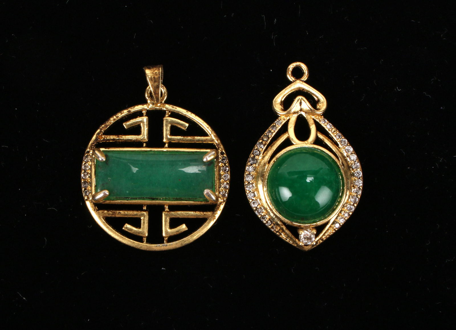 TWO JADE PENDANTS (1 of 2)
