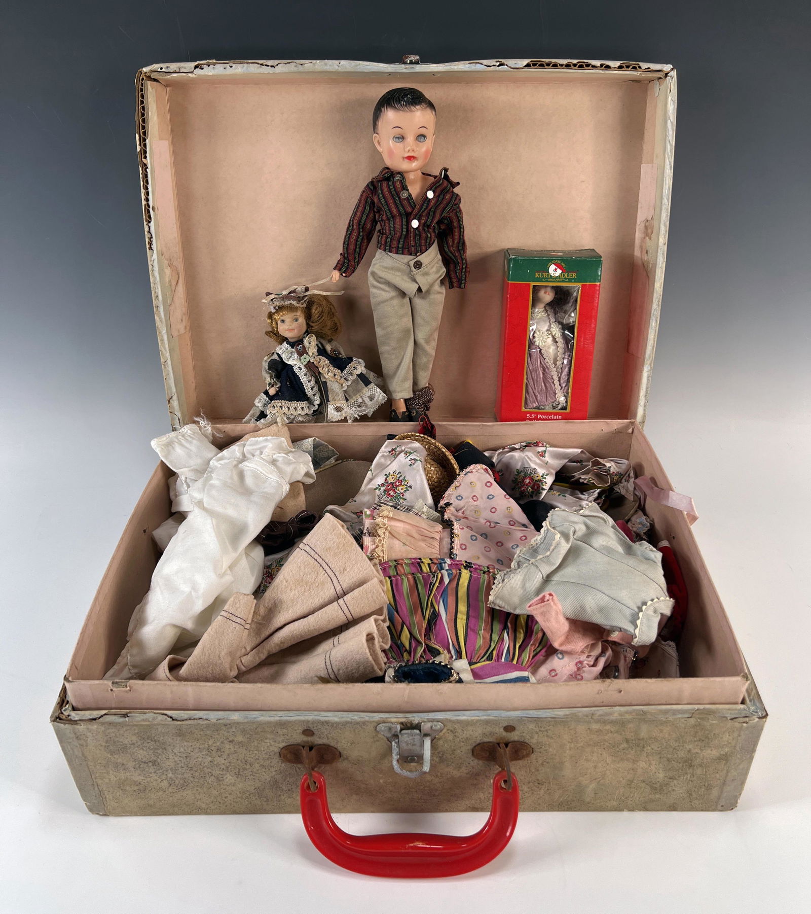 VINTAGE DOLLS WITH CLOTHES IN CARRYING CASE (1 of 6)