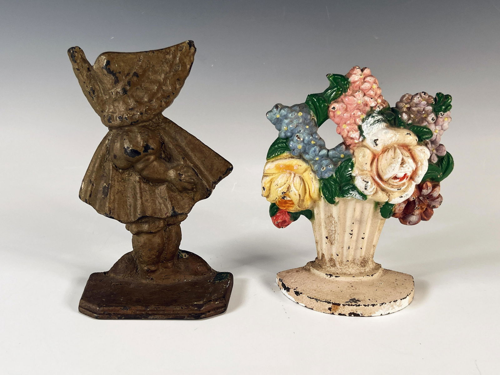 TWO CAST IRON DOORSTOPS (1 of 3)