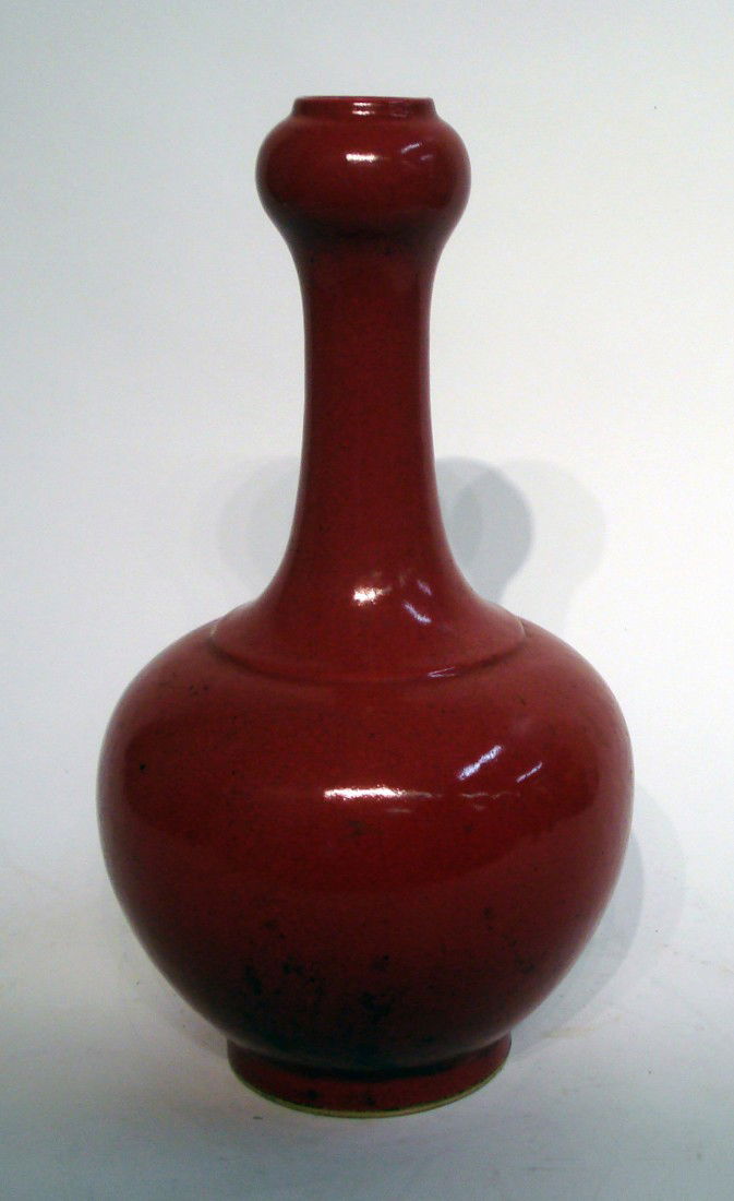 Oxblood Red Porcelain Vase: A 15" vase with crackleature finish . Six character signature. Late 19th century. Shipping: We are unable to ship this item. Please contact our local UPS Store, store1152@theupsstore.com, for a quote.