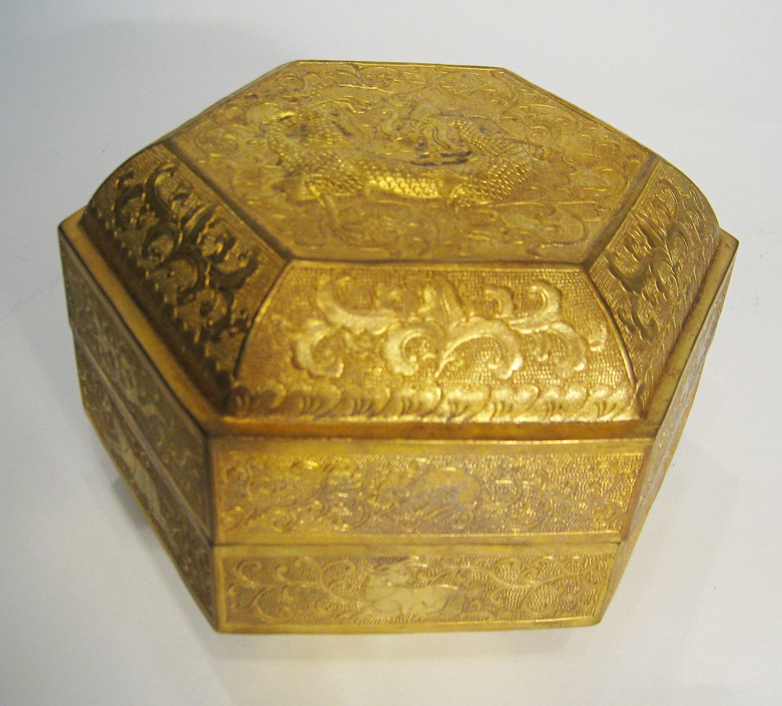 Bronze Box: A two piece gilt bronze box, 5" X 7" with a signature mark on the bottom. Shipping: We are able to pack and ship this item to an address in the United States for $25.00 via USPS Priority Mail. Trackin