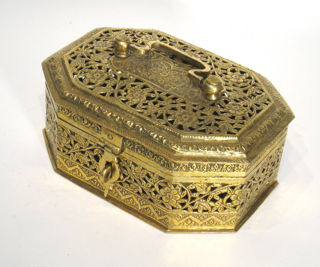 Brass Box: A pierced cast brass safe box with a hinged lid and hasp. 4 1/2" X 10" X 7". Shipping: We are able to pack and ship this item to an address in the United States for $30.00 via USPS Priority Mail. Trac