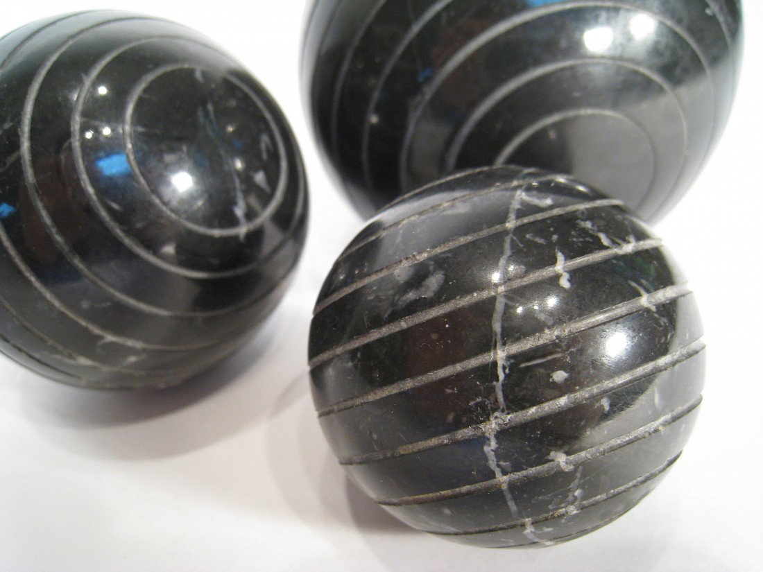 Three Black Marble Balls: Three different sized solid marble balls for decoration. Largest about 3 1/2". Shipping: We are able to pack and ship this item to an address in the United States for $40.00 via USPS Priority Mail. Tr