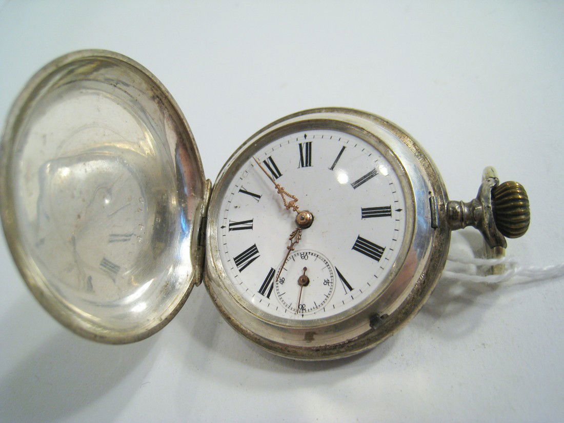 Silver Hunting Cased Watch: A Swiss or French made hunting cased pocket watch with a 47 mm case with a lever set and stem wind cylinder escapement movement. Running. Lacking crystal. Shipping: We are able to pack and ship this i