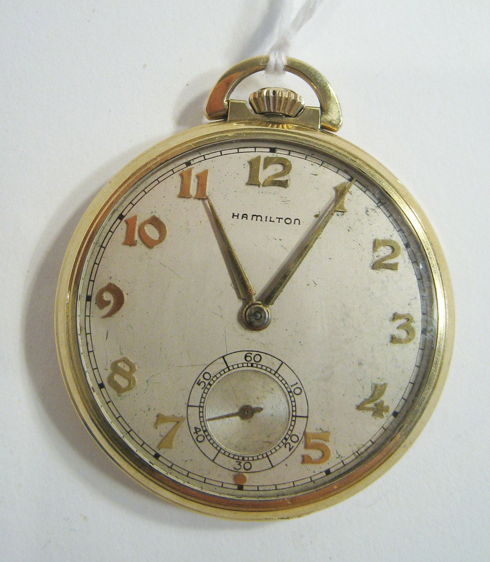Hamilton Dress Watch: A 14K Gold filled thin style dress watch by Hamilton, with 17 jewels, model 917. Shipping: We are able to pack and ship this item to an address in the United States for $15.00 via USPS Priority Mail. 