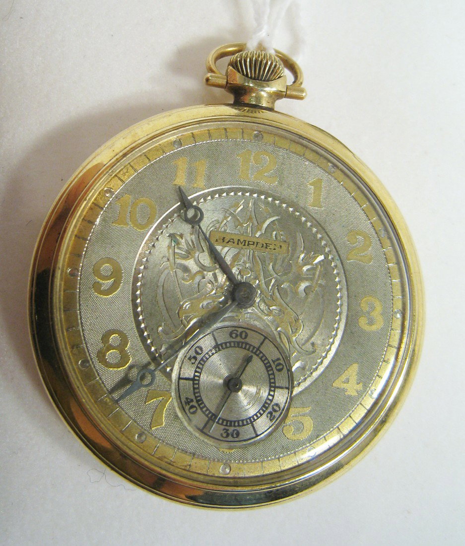 Hampden Dress Watch: A Dueber 46 mm cased open faced dress watch with an engraved silver and gold dial by Hampden, whose 15 jewel movement, the "Nathan Hale" model, is # 3614861 may run, but whose mainspring is in disrepa