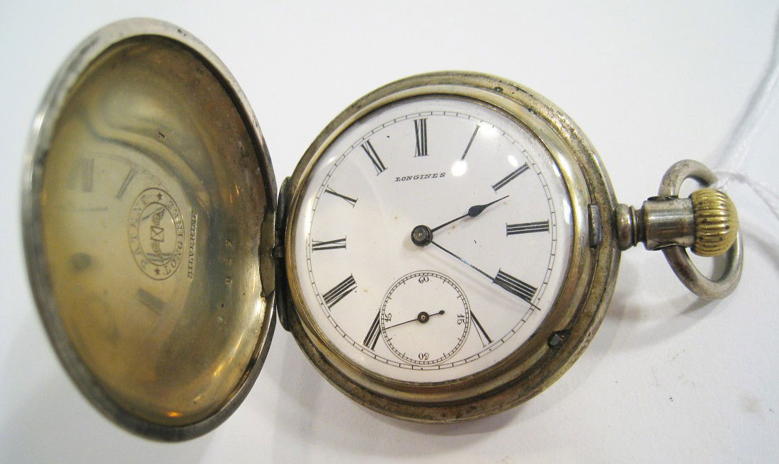 Silver Hunting Cased Longines: In a silverrine case te watch with fifteen jewels with a jeweled lever escapement. Shipping: We are able to pack and ship this item to an address in the United States for $15.00 via USPS Priority Mail